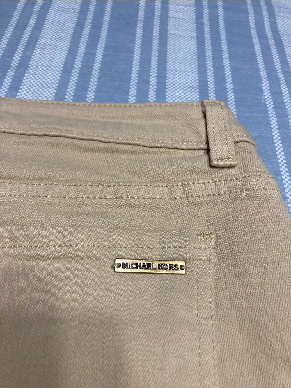 Michael Kors tan Bermuda shorts.